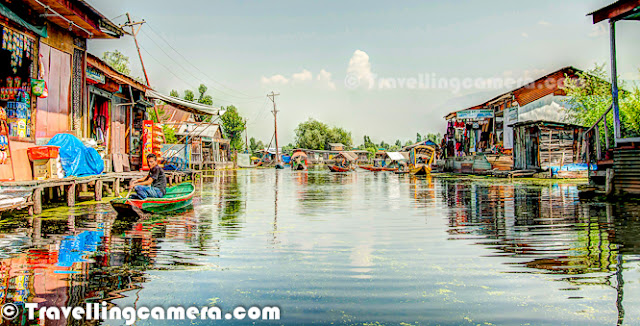 Dal Lake is one of the most popular lakes of India, which is located in Srinagar, the summer capital of Jammu and Kashmir. The urban lake, which is the second largest in the state, is integral to tourism and recreation in Kashmir and is nicknamed the 'Jewel in the crown of Kashmir' or 'Srinagar's Jewel'. The lake is also an important source for commercial operations in fishing and water plant harvesting.The shore line of the lake is encompassed by a boulevard lined with Mughal era gardens, parks, houseboats and hotels. Scenic views of the lake can be witnessed from the shore line Mughal gardens, such as Shalimar Bagh and Nishat Bagh built during the reign of Mughal Emperor Jahangir) and from houseboats cruising along the lake in the colourful shikaras. Dal Lake has some Floating gardens as well. The floating gardens, known as 'Rad' in Kashmiri, blossom with lotus flowers during July and August. The wetland is divided by causeways into four basins - Gagribal, Lokut Dal, Bod Dal and Nagin (although Nagin is also considered as an independent lake). During our trip to Shrinagar, we stayed in a hotel around Nagin lake only. Oldest Five star of the city is located on the bank of Nagin Lake. Lokut-dal and Bod-dal each have an island in the centre, known as Rup Lank (or Char Chinari) and Sona Lank respectively.  There are some personal houses around Dal Lake and people have their own boats to travel from one place to another for getting stuff from Lake-Market, which is again located inside Dal Lake only. Houseboats and the Dal Lake are widely associated with Srinigar and are nicknamed 'floating palaces', built according to British customs.The houseboats are generally made from local cedar-wood and are graded in a similar fashion to hotels according to level of comfort.Many of them have lavishly furnished rooms, with verandas and a terrace to serve as a sun-deck or to serve evening cocktails.They are mainly moored along the western periphery of the lake, close to the lakeside boulevard in the vicinity of the Dal gate and on small islands in the lake. They are anchored individually, with interconnecting bridges providing access from one boat to the other.The kitchen-boat is annexed to the main houseboat, which also serves as residence of the boatkeeper and his family.Many boats on Dal Lake are used for selling stuff to tourists. Anything like Artificial Jewellery, Corns, Fruits, Cloths, Wooden Articles, Flowers etc. Some of the vendors can be seen selling digital-cards for still/video cameras.        Each houseboat has an exclusive shikara for ferrying guests to the shore. A shikara is small paddled taxi boat, often about 15 feet and made of wood with a canopy and a spade shaped bottom.It is the cultural symbol of Kashmir and is used not only for ferrying visitors but is also used for the vending of fruits, vegetables and flowers and for the fishing and harvesting of aquatic vegetation.All gardens in the lake periphery and houseboats anchored in the lake are approachable through shikaras.The boats are often navigated by two boatmen dressed in 'Phiron' (traditional dress) and carry 'Kangris' or portable heaters on the boat.A shikara can seat about six people and have heavily cushioned seats and backrests to provide comfort in Mughul style.All houseboat owners provide shikara transport to their house guests free of charge. The shikara is also used to provide for other sightseeing locations in the valley, notably a cruise along the Jhelum River, offering scenic views of the Pir Panjal mountains and passing through the famous seven bridges and the backwaters enroute.