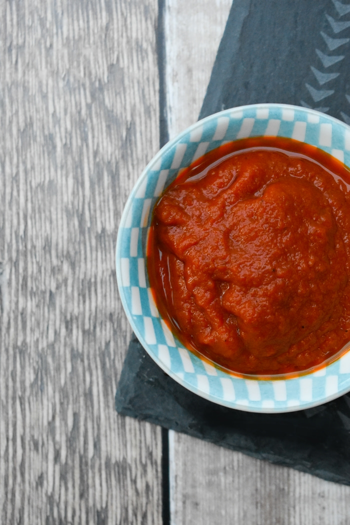 Smoky chipotle tomato ketchup in a small blue bowl