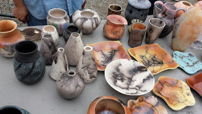 Finished pottery pieces from a raku firing - horsehair raku, naked raku, saggar raku.