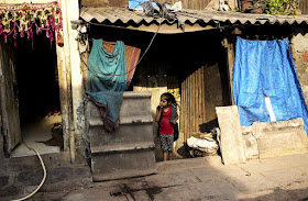 child playing hide and seek kumbharwada dharavi mumbai india street streetphoto