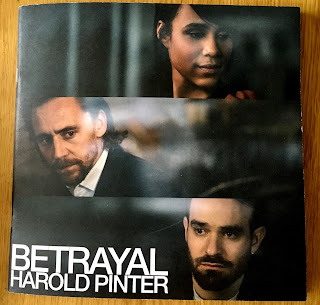Programme showing three actors  Zawe Ashton at the Top, Tom Hiddleston centr and Charlie Cox below, with text reading 'Betrayal. Harold Pinter'