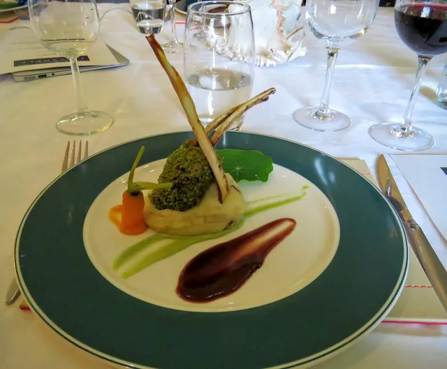 herb crusted Tubbercurry Sligo lamb with red wine and rosemary reduction, mint courgette puree, and seaweed mash