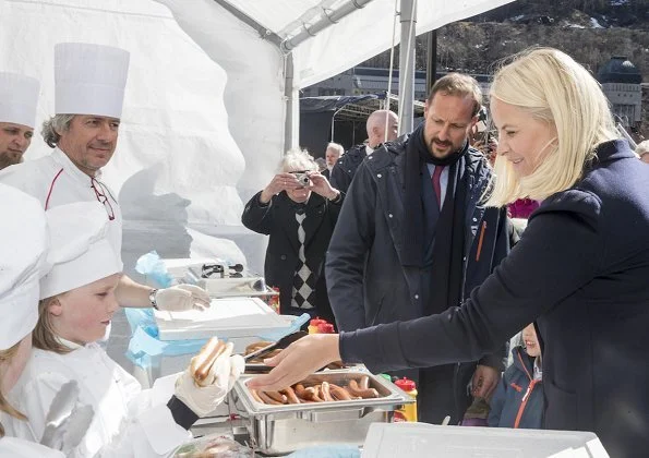 Crown Princess Mette-Marit wore Valentino coat and she wore Prada Brown Knee High Crocodile Boots. Telemark Rjukan-Notodden heritage site