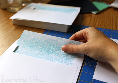 Lining wedding invitation envelopes with waves pattern - Concertina Press