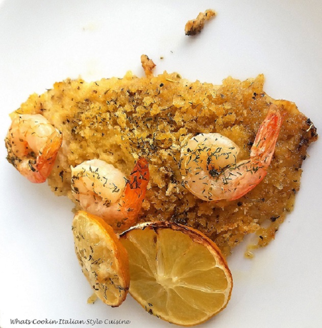 this is a flounder baked with a buttery wine sauce topped with shrimp and sliced lemon