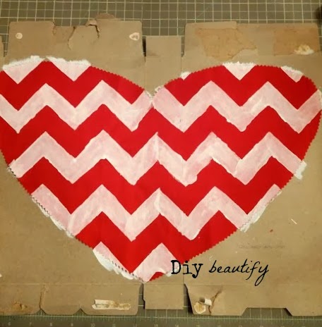Looking for something unique to hang on your door this Valentines? Make this burlap heart! Step by step directions included at diy beautify!