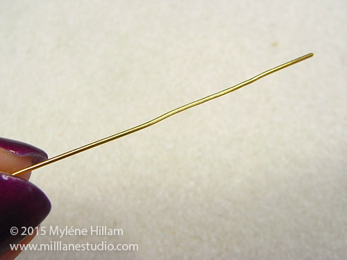 A straightened head pin