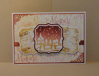 Christmas card in warm red and brown/cream shades; three squares with a central snow scene