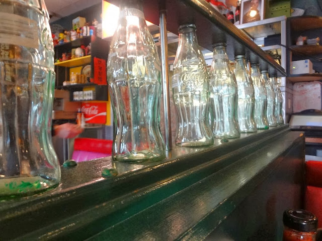 Vintage Coke bottle railing, inside Sophie's Cosmic Cafe, Vancouver