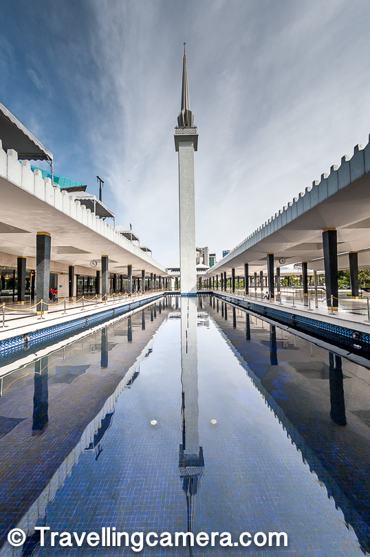 240 feet high minaret at National Mosque, Kuala Lumpur. That's the one you see in almost all photographs because it's hard to ignore it :). Just below this minaret , there is a water pond and the reflections looks just awesome which is hard to express in words and above photograph doesn't do justice to it. 