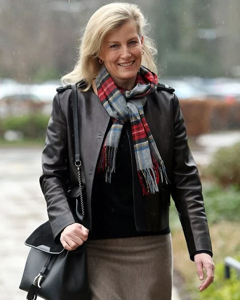 Countess Sophie wore Prada black leather jacket, ankle-skimming merino-wool skirt by Gabriela Hearst and a colourful tartan scarf.