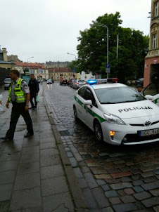 A Policeman arriving to evict the illegal street hawkers in Vilnius.