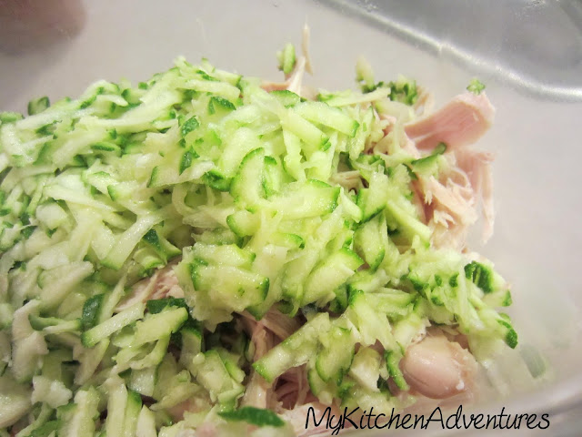 Shredded chicken and shredded zucchini in a bowl