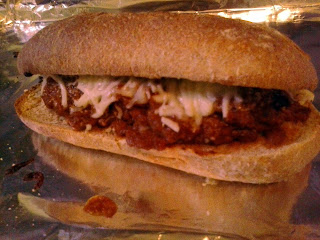 Meatball Sub:  Way better than subway.  This Meatball Sub is the third meal made from my Slow Cooker Meatballs in a Whole Wheat Italian roll smothered in cheese.