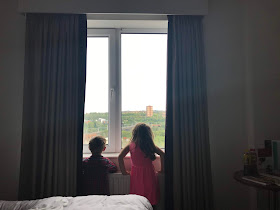 kids looking out hotel window in newcastle 