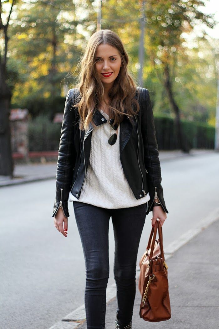 White sweater, brown tote bag and leather coat