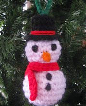 http://www.ravelry.com/patterns/library/snowman-ornament-11