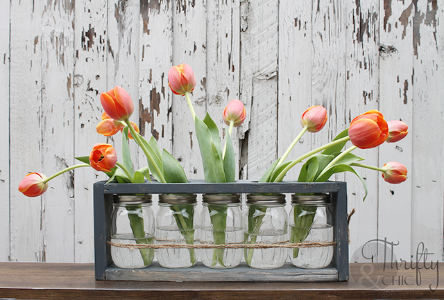 DIY Mason jar and wood vase centerpiece. Perfect for spring decor and wedding decor!