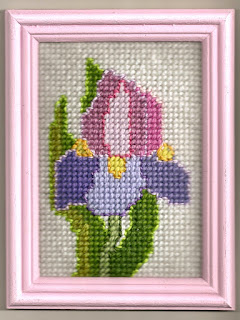 Iris needlepoint with light colored top stitching