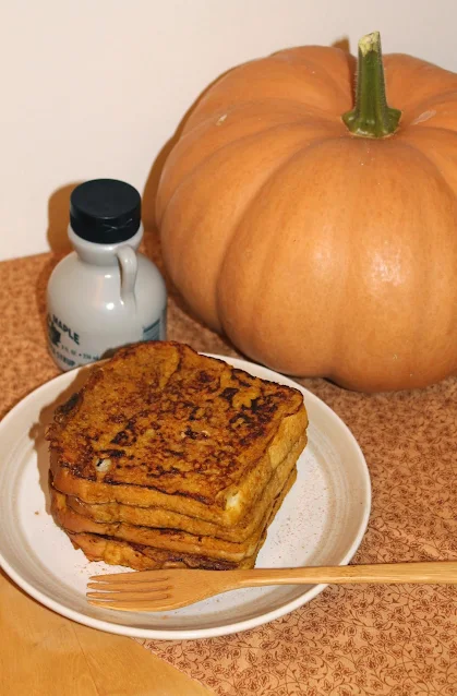 Stack of pumpkin pie French toast on a plate.