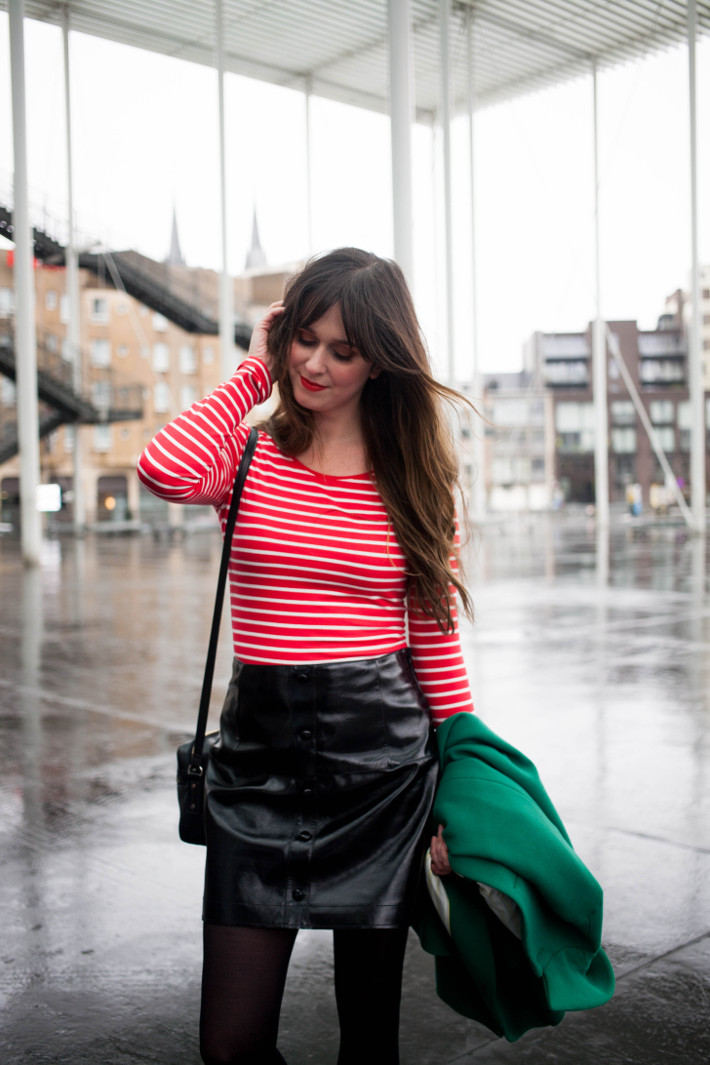 green coat, red tripes, pleather skirt