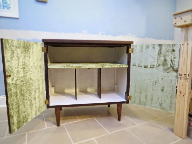 fabric lined interior of cabinet