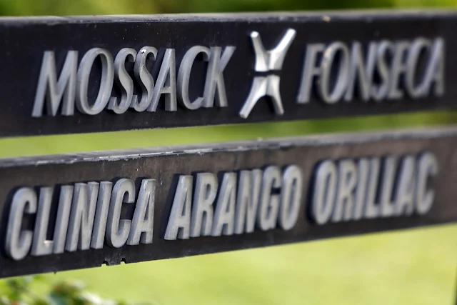 Image Attribute: A company list showing the Mossack Fonseca law firm is pictured on a sign at the Arango Orillac Building in Panama City April 3, 2016. REUTERS/Carlos Jasso