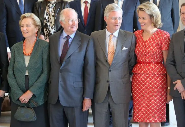 Members of the Belgian Royal Family hosted a reception at the Royal Castle in Laeken. wore this peplum belted and printed dress