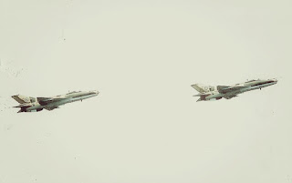 Two Nigerian Air Force F-7 Air Guard undertaking an aerial maneuver