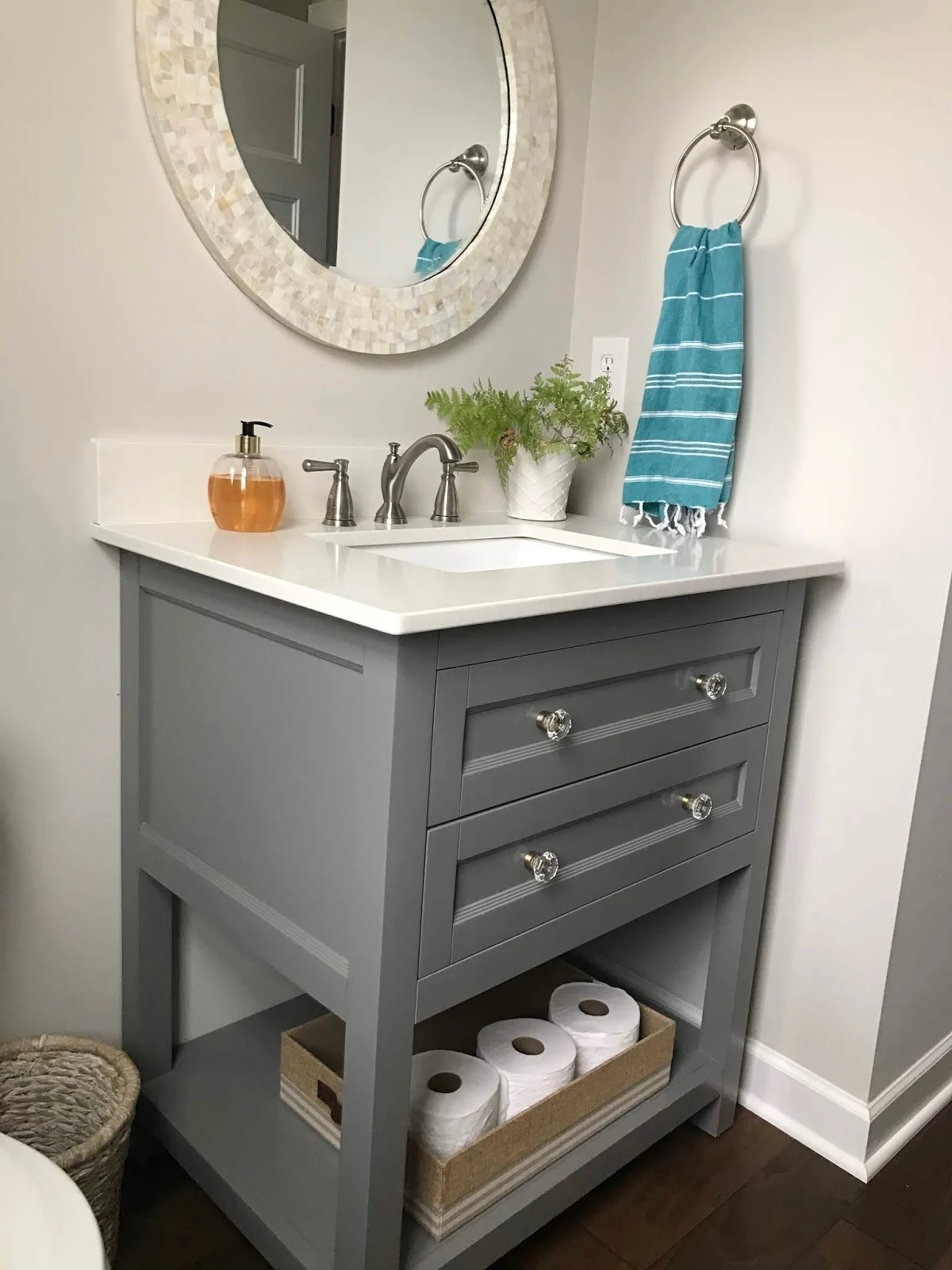Light gray bathroom vanity with drawers
