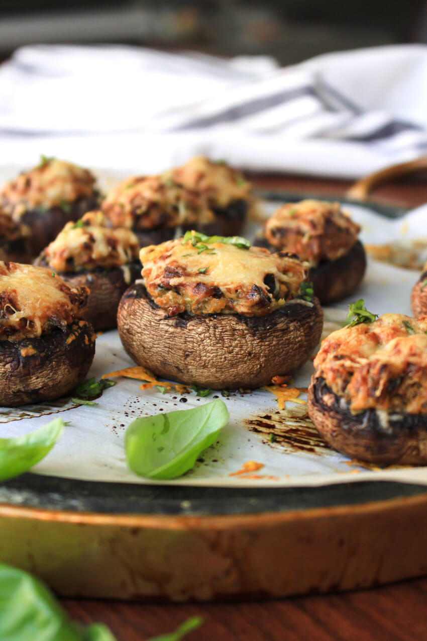 Sun-Dried Tomato and Basil Stuffed Mushrooms are made with a decadent cheesy filling.  They are an elegant, yet easy to make appetizer that is perfect for any occasion!  #stuffedmushrooms #appetizer