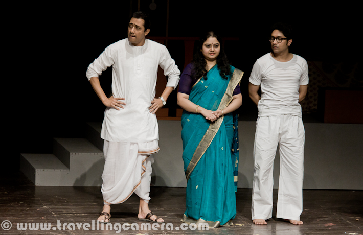 Byomkesh play was performed at 14th Bharat rang Mahotsav 2012. It was one of the exciting plays of Bharangam 2012. It was performed in Kamani and whole auditorium was full of audience from various parts of the country. Let's have a quick Photo Journey of Byomtesh, a Bengali play with English subtitles...Inspired by the fictitious character of Sherlock Holmes, Byomkesh Bakshi was created as the intelligent, mystery-loving and mystery-solving detective of Bengali literature. And most of the folks also relate to Byomtesh as one of the popular Indian Detective, who was seen many times on Doordarshan-1. This is one of the TV-Serials, our generation has seen on DD-1. During childhood Byomkesh was one of the hero and now if we see some of the episodes, it looks like a comedy serial. This play was on same lines, but there were few things which were seriously taken care of.Play starts with a phone call to Byokesh that an old man of a family has been found dead with some odd things happening in the family. At the same time police has started the investigations around the case. There was a very common thing in all Byomkesh episodes on Doordarshan and Police used to give some non-sense reasoning. And Byomkesh always used to think differently. Same thing happened in this play as well. police Inspector was interesting and delivered some of the humorous dialogs brilliantly. There were some flash-back scenes in this play. Above scene was shown when Police Inspector was asking questions from home servant in that house. He is in flash-back and thinking of conversation between him and his Boss, who is not alive now.Similar to Holmes who had his companion in Watson, Byomkesh also cultivates the friendship of Ajit Bandhopadhyay who is his perennial fellow adventurer on his quest to solve mysteries and murders. Holmes and Byomkesh had one major difference - the former was disinterested in women and stayed a bachelor, while Byomkesh meets his life-partner Satyabati and eventually marries her. See the photograph below, which is a conversation about investigations but expressions of Byomkesh can interpreted in two ways...Here Byomkesh is interrogating one of the lady in house and she has few things missing from her room. Initially she was very comfortable and denied of any change in her room. But later it came out that a needle was missing from her room, which was found near Dead-body. Let me stop here as I am not supposed to share exact story here.One of the family-member was fond of Sitar and most of the times he can be found on it. He was handicapped and looked someone who is more into reading, music & happy to be alone.After all interrogation sessions with different Family Members and more information from outside sources, Byomkesh reaches to final culprit and he accepts his fault. Above photograph shows the scene when Byomkesh is explaining everything about the case.Finally Byomkesh also fallen in love with the girl from same house and here is a photograph clicked during end of the play.Here are some of the Theatre Performers in Bengali Play BYOMKESH, during 14th Bharat Rang Mahotsav 2012. They are with one of the typical action/posture/style, which they portrayed in this play.The play Byomkesh presents the life and times of one of the greatest fictitious character of crime thrillers. It unveils the mysteries, intricacies and compulsions, motives and hidden agendas of human relationships and simultaneously throws light on the baser instincts as well as the higher aspirations and values of human beings.Bratya Basu standing on Kamani Stage with his crew of Byomkesh after successful completion of the performance during 14th Bharat Rang Mahotsav 2012.This play was in Bangla and English subtitles were being shown on top of the stage. At times, Bangla dialogs were so fast that it was extremely difficult to read the dialogs written in English. Since there were lot of Bengali folks in the ground to help us in making sure that we laugh when required :) ... Anyway, play was full of laughter with interesting punches in between.Emmanuel Singh and Rajni from National School of Drama, who are facilitating post play ceremony of presenting flowers and momento of 14th Bharat Rang Mahotsav to Director and Team of Byomkesh play.Subhrajit Dutta, who is standing in the middle, played the role of Byomkesh Bakshi in this play. Some of the more details about this role in Bratya Basu's Byomkesh, check out http://articles.timesofindia.indiatimes.com/2011-02-22/news-interviews/28625059_1_byomkesh-bakshi-stage-roleHere was a quick PHOTO JOURNEY from Byomkesh play during 14th Bharat Rang Mahotsav 2012 at Kamani Auditorium. This festival is being organized by National School of Drama, Delhi with support from Minitry of Culture. 22nd, which means today is last day of this festival and I will eagerly be waiting for NSD Repretory's Summer Theatre Festival 2012.