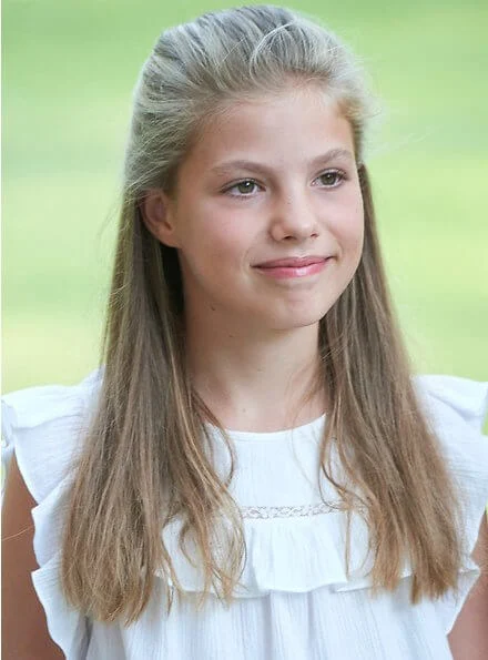 Princess Leonor wore Mango floral print top and trousers, Queen Letizia wore a pink floral print v-neck summer dress