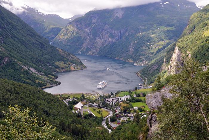 The Geirangerfjorden is a fjord in the Sunnmøre region of Møre og Romsdal county, Norway. It located entirely in Stranda Municipality. It is a 15-kilometre (9.3 mi) long branch off of the Sunnylvsfjorden, which is a branch off of the Storfjorden (Great Fjord). The small village of Geiranger is located at the end of the fjord where the Geirangelva river empties into it.