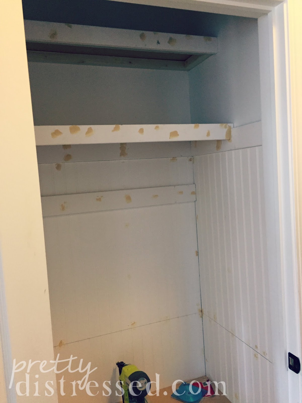 Pretty Distressed Hall Closet Turned Mini Mudroom Makeover