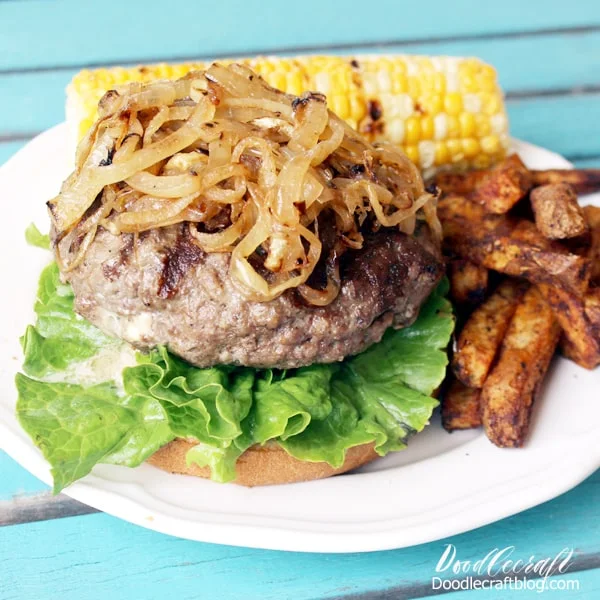 Thick hamburger stuffed with blue cheese crumbles topped with sauteed onions served with french fries and grilled corn.
