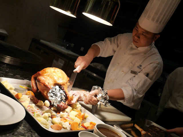 chef cutting off a turkey leg