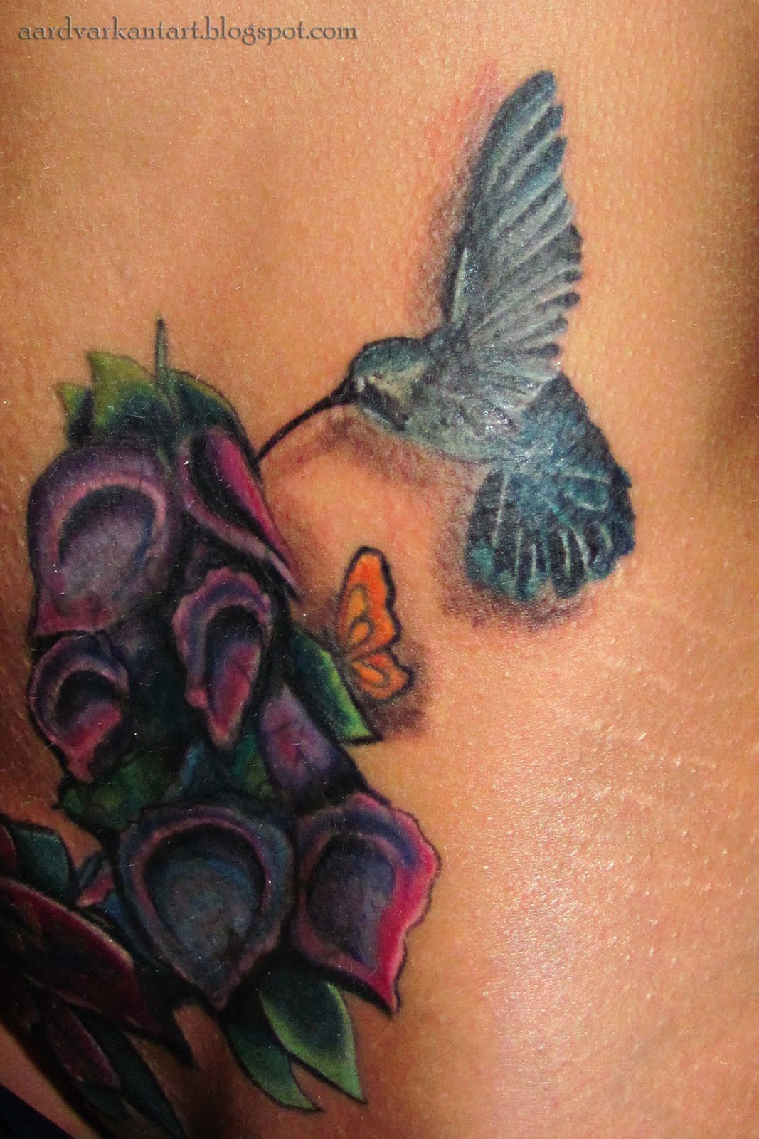 http://2.bp.blogspot.com/-Mp28xYKx4Jw/Tc4E_fdqbsI/AAAAAAAAAPQ/Fs68GGVKFVQ/s1600/blue+hummingbird+tattoo.jpg