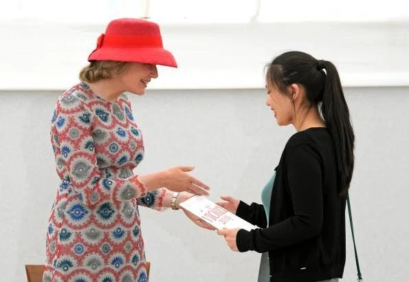 Queen Mathilde wore Natan print dress. Winner of the Queen Elisabeth Competition Stella Chen and Queen Mathilde