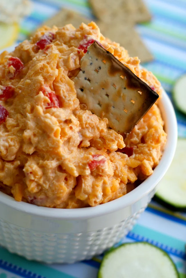With the addition of some smoked paprika and a splash of beer, this Drunken Pimento Cheese is a delicious twist on the classic cheese spread that is great served with crackers, veggies, or as a sandwich spread.  You will want to eat it with everything!