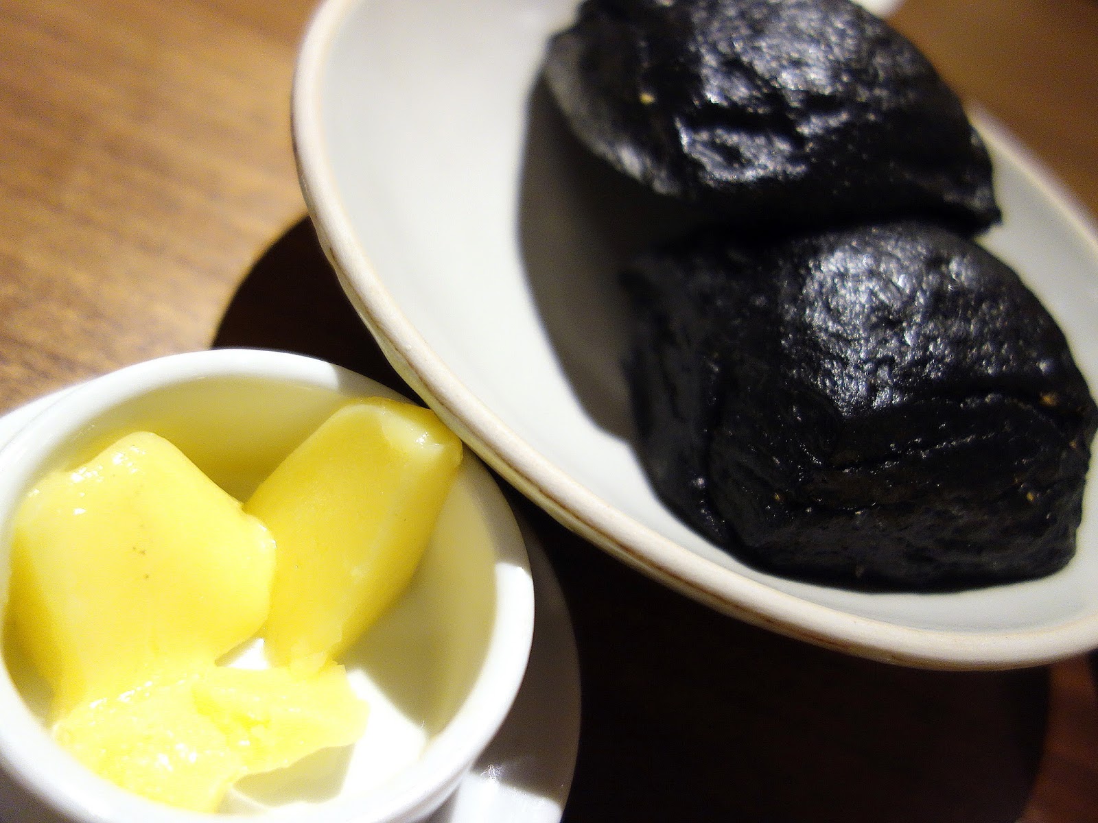 Commence with complimentary charcoalblack bread rolls