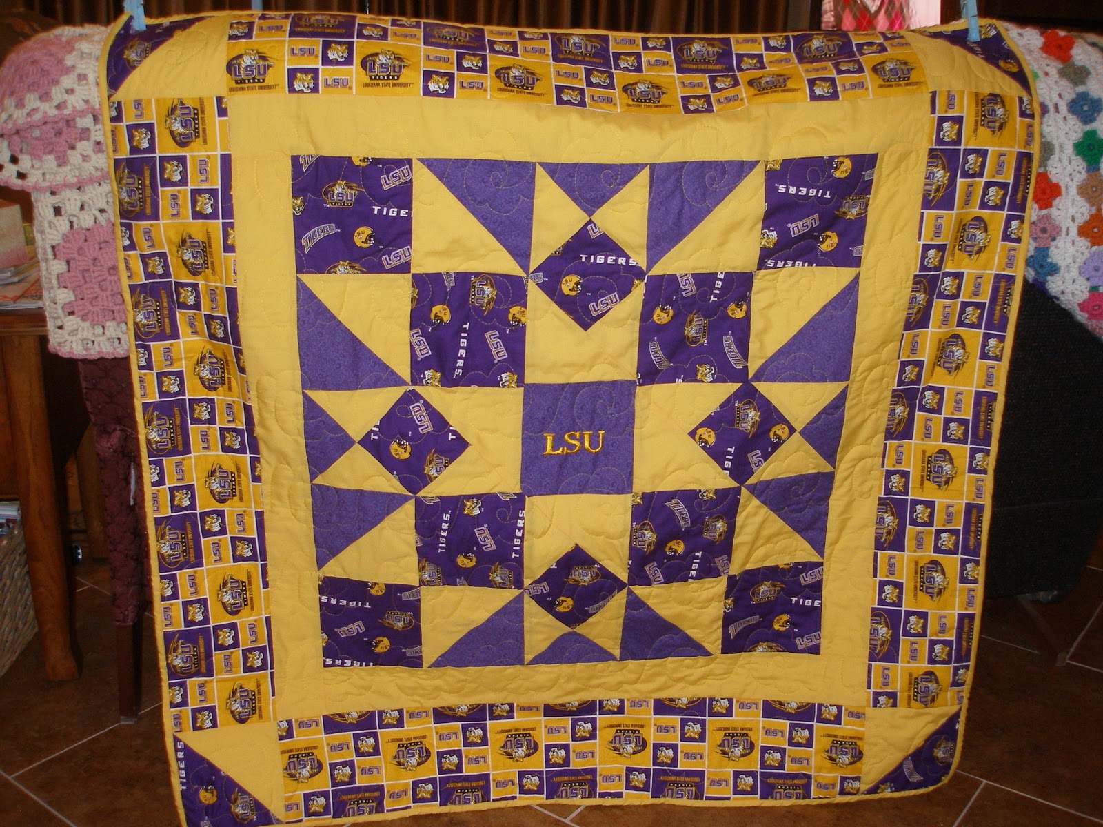 Beebee's Quilts and More Two lap quilts with local sports themes.