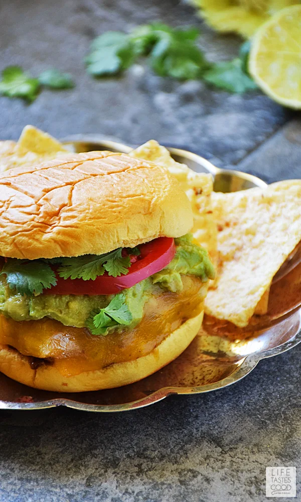 Guacamole Cilantro Lime Cheeseburger | by Life Tastes Good is an easy recipe using fresh ingredients to maximize flavor! A Mexican inspired burger perfect for a summer bbq, lunch, dinner, or even a pool party! #LTGrecipes #SundaySupper