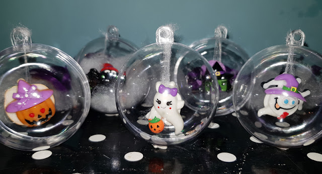 Filling clear baubles with Halloween buttons 