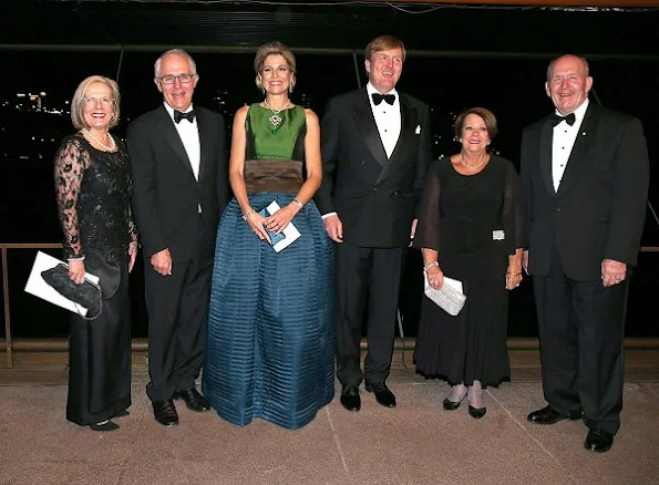 Queen Maxima diamond earrings, aqua-marine earrings satin long dress, Natan shoes