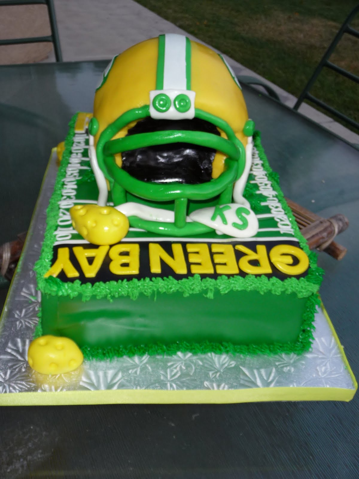Choozo Choozi & Family: Green Bay Packers helmet on a field cake