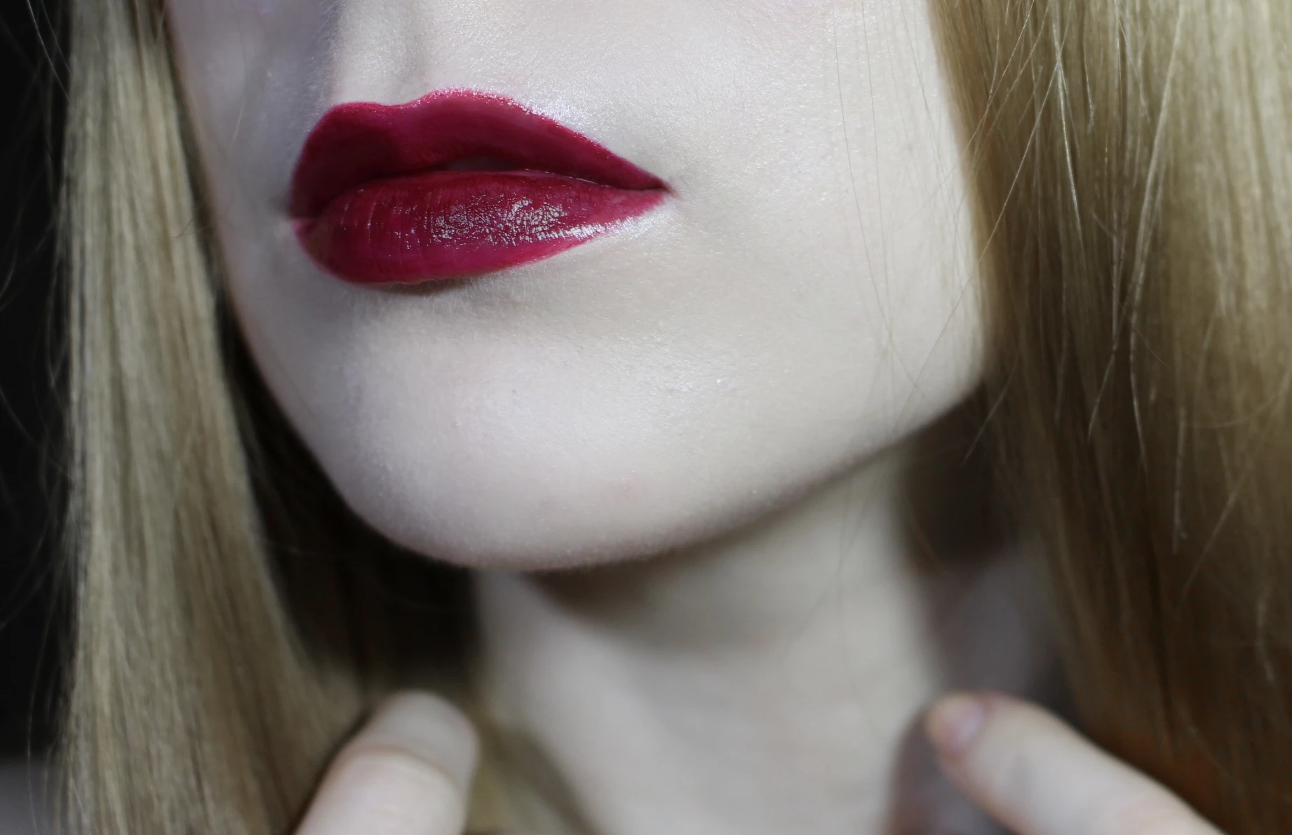 blonde woman with a dark red lip makeup