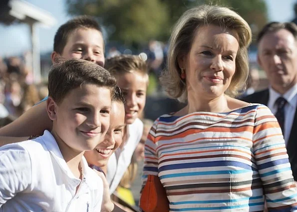 Queen Mathilde visit uberge du Vivier' care center and business center in Libin. Mathilde wore Natan dress