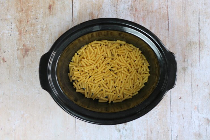 Uncooked macaroni in slow cooker