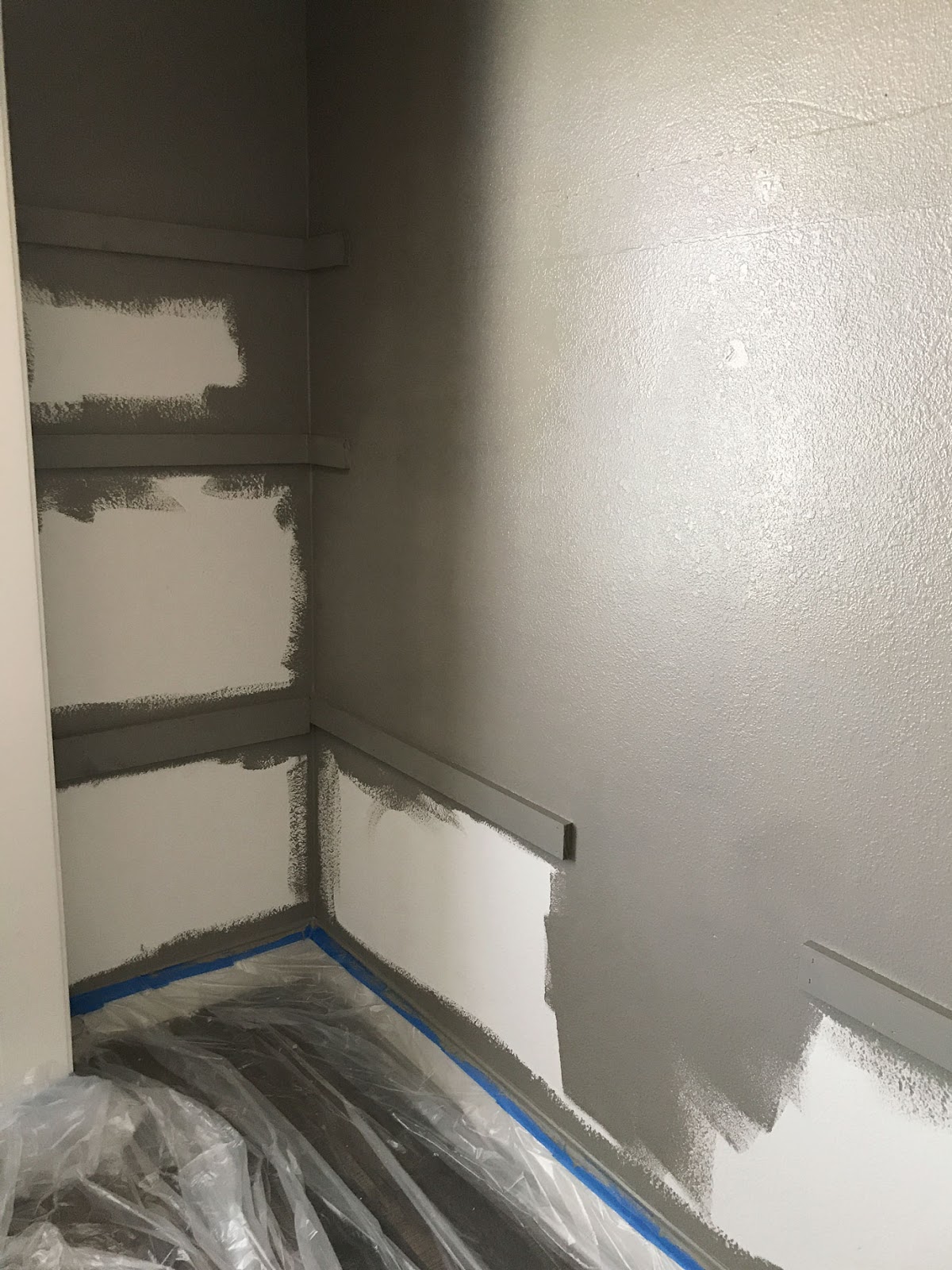 Painting the inside of the office closet desk space and the shelf supports